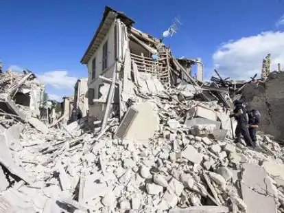 Rescuers search for survivors under the rubble of the town of Amatrice, central Italy, Wednesday, Aug. 24, 2016 following an earthquake. A strong earthquake rocked central Italy early Wednesday, collapsing homes on top of residents as they slept. (Massimo Percossi/ANSA via AP)