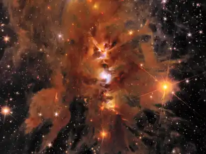 «Messier 78»: ein leuchtender, von interstellarem Staub umhüllter Sternhaufen.